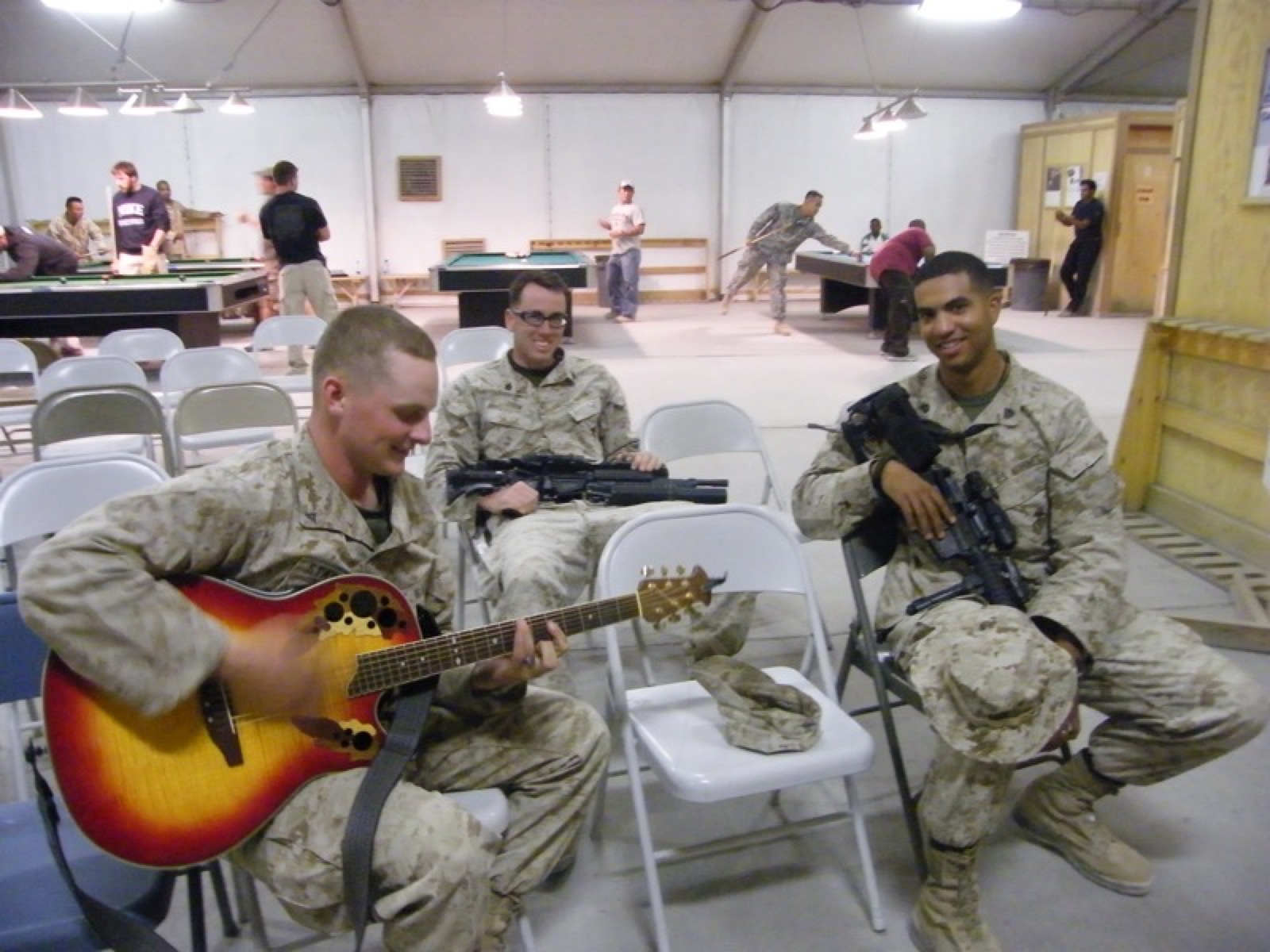 After the show: a Marine borrows the guitar